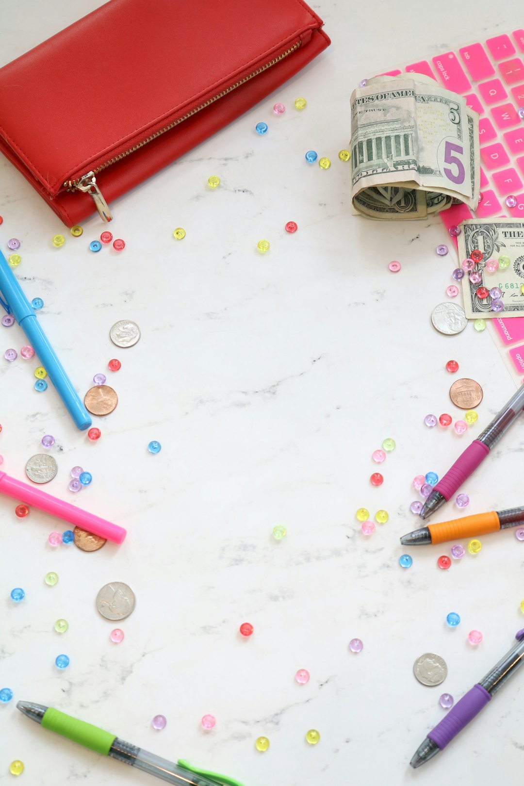 services-02 Marble money stock photo and money styled stock photo for personal finance bloggers, business coaches, and entrepreneurs with a pink keyboard, colorful pens, cash, a red wallet, and more.