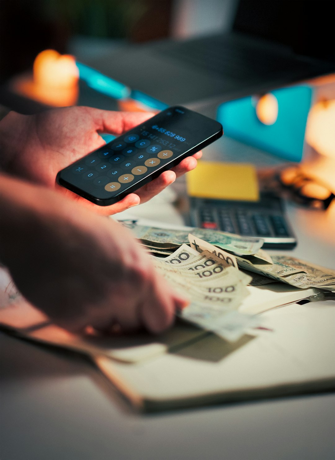 services-04 Smartphone calculator Polish currency counting budget finance Person using phone calculator
